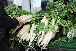 market display of white root vegetables
